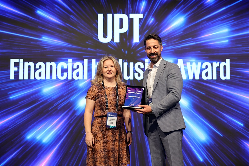 UPT receiving the Financial Inclusion Award